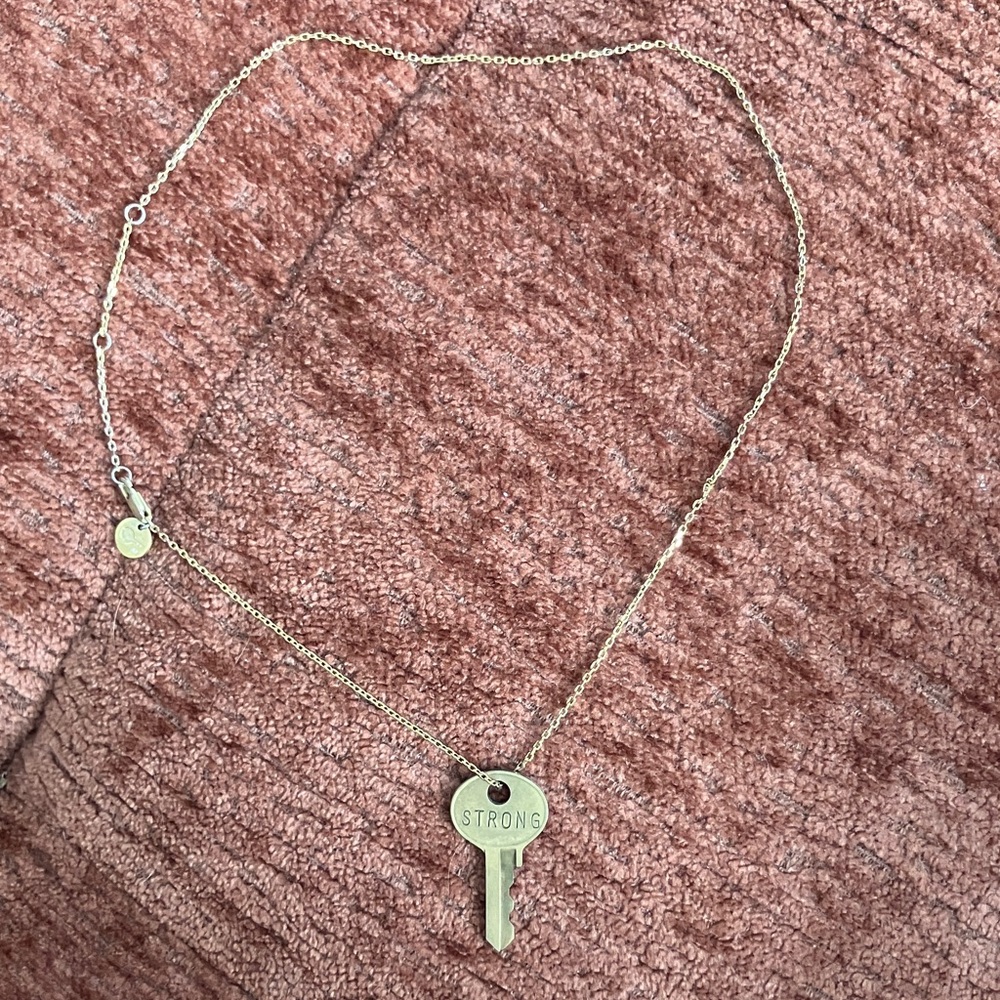 Giving Key “Strong” Gold Pendant Necklace